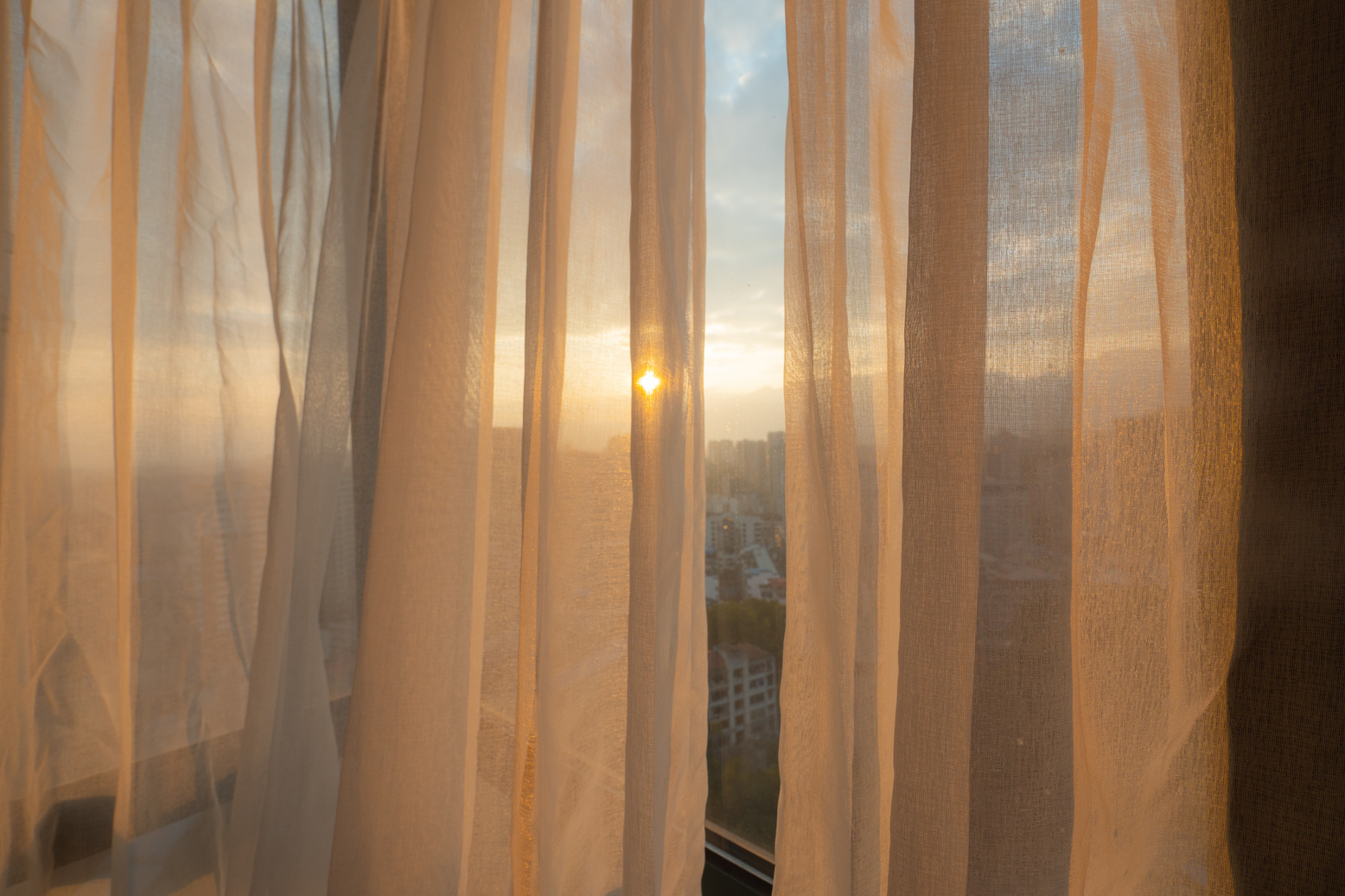 Window curtain with morning sunlight